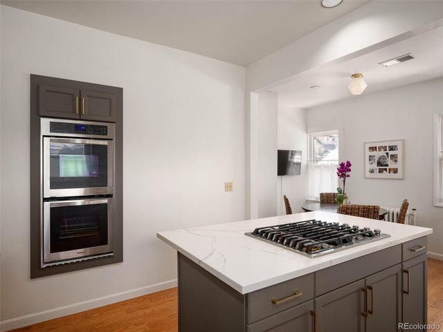 a kitchen with a stove and a microwave