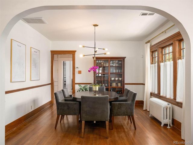 a dining room with furniture window wooden floor