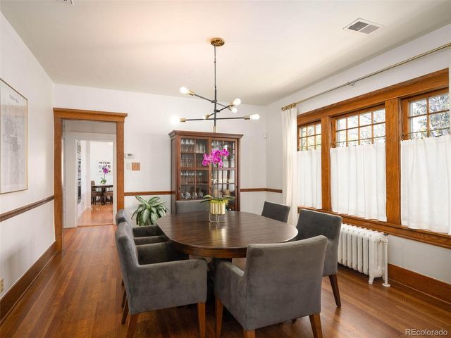 a dining room with furniture window wooden floor