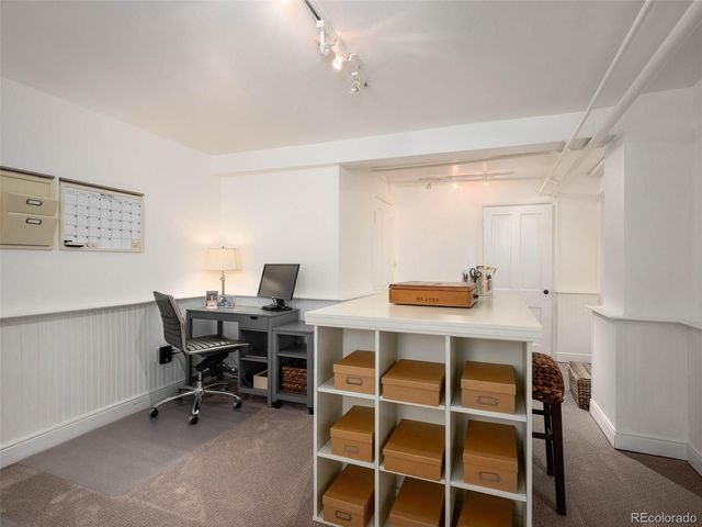 a view of a workspace with furniture