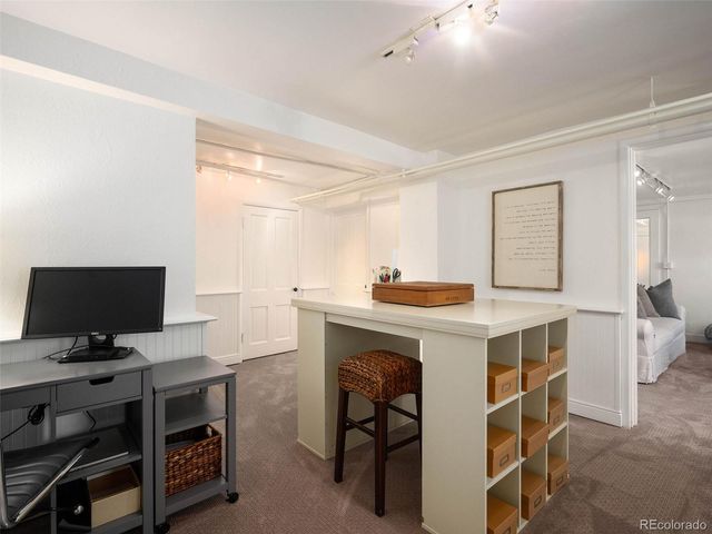 a view of kitchen with sink microwave and refrigerator