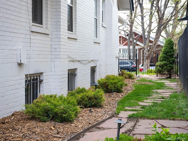 a brick building with a yard