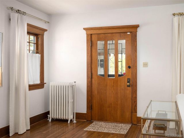 a view of front door with wooden floor