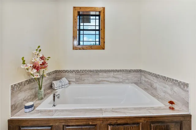 a view of walk in closet and utility room