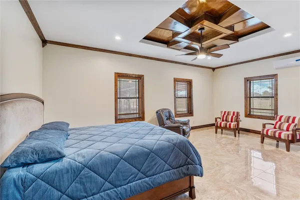 a bedroom with furniture and wooden floor