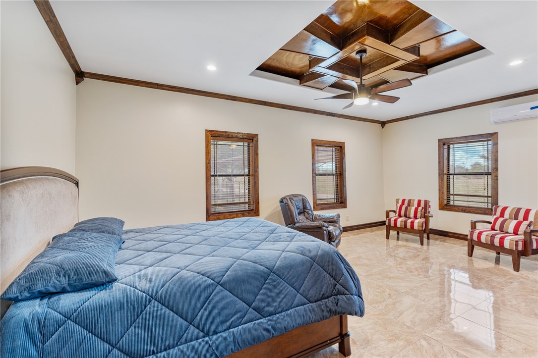 1058 South Smith Street Hebbronville, TX 78361 - Photo 16 of 40 a bedroom with a bed a table and chairs