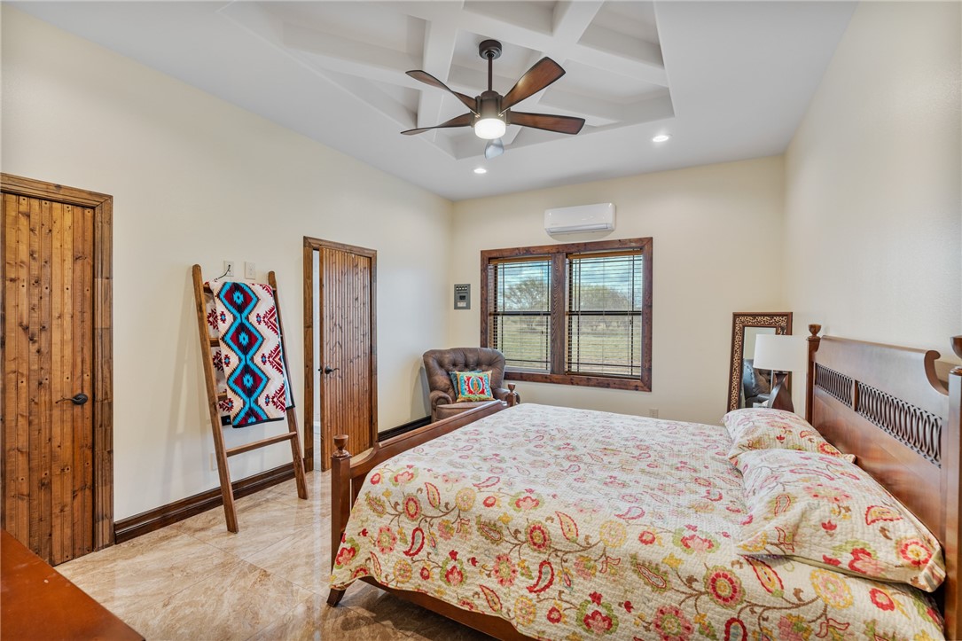 1058 South Smith Street Hebbronville, TX 78361 - Photo 20 of 40 a bedroom with a bed and a large window