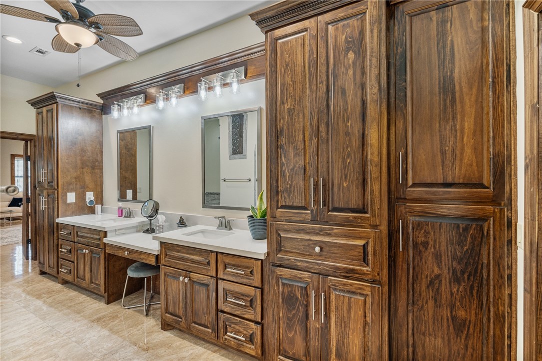 1058 South Smith Street Hebbronville, TX 78361 - Photo 22 of 40 a bathroom with double vanity and a mirror