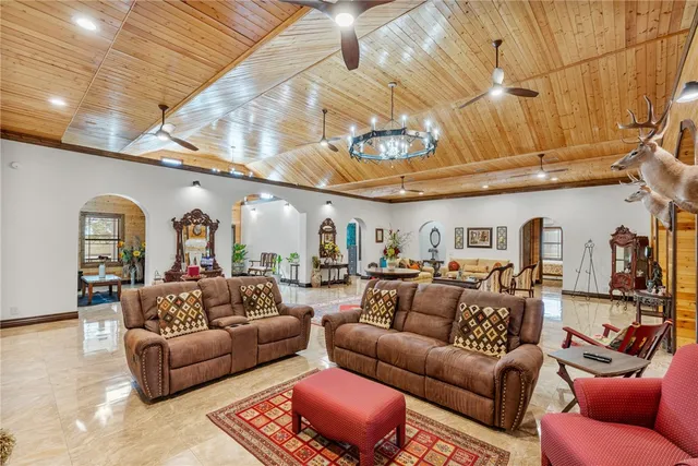 a view of an chairs and table in a room