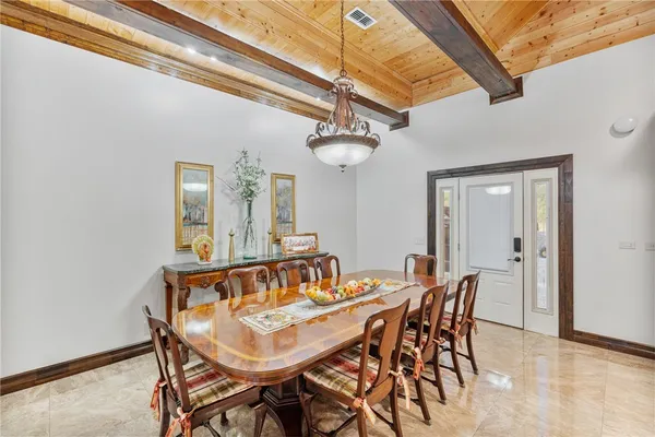 a kitchen with a stove a sink dishwasher and a refrigerator with wooden cabinets