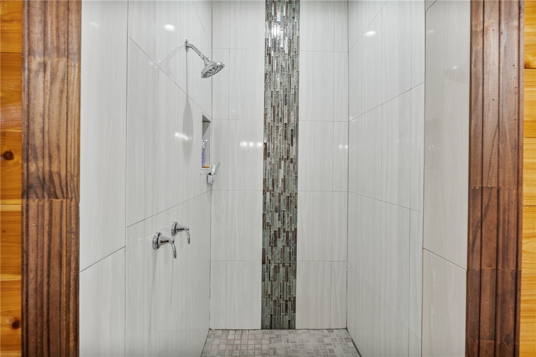 1058 South Smith Street Hebbronville, TX 78361 - Photo 35 of 40 a bathroom with a shower