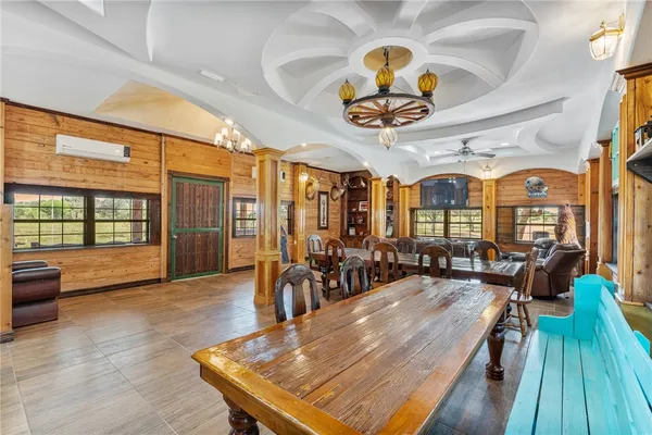 a view of a dining room with furniture window and outside view
