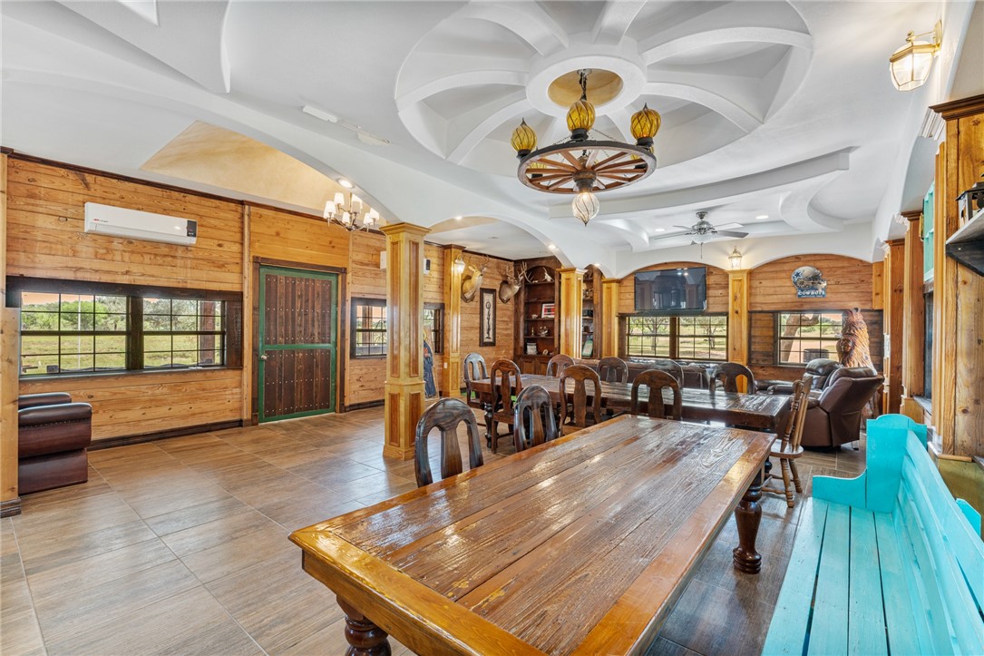 1058 South Smith Street Hebbronville, TX 78361 - Photo 37 of 40 a view of a dining room with furniture wooden floor and chandelier