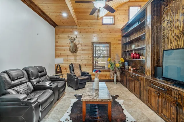 a bedroom with furniture and natural light