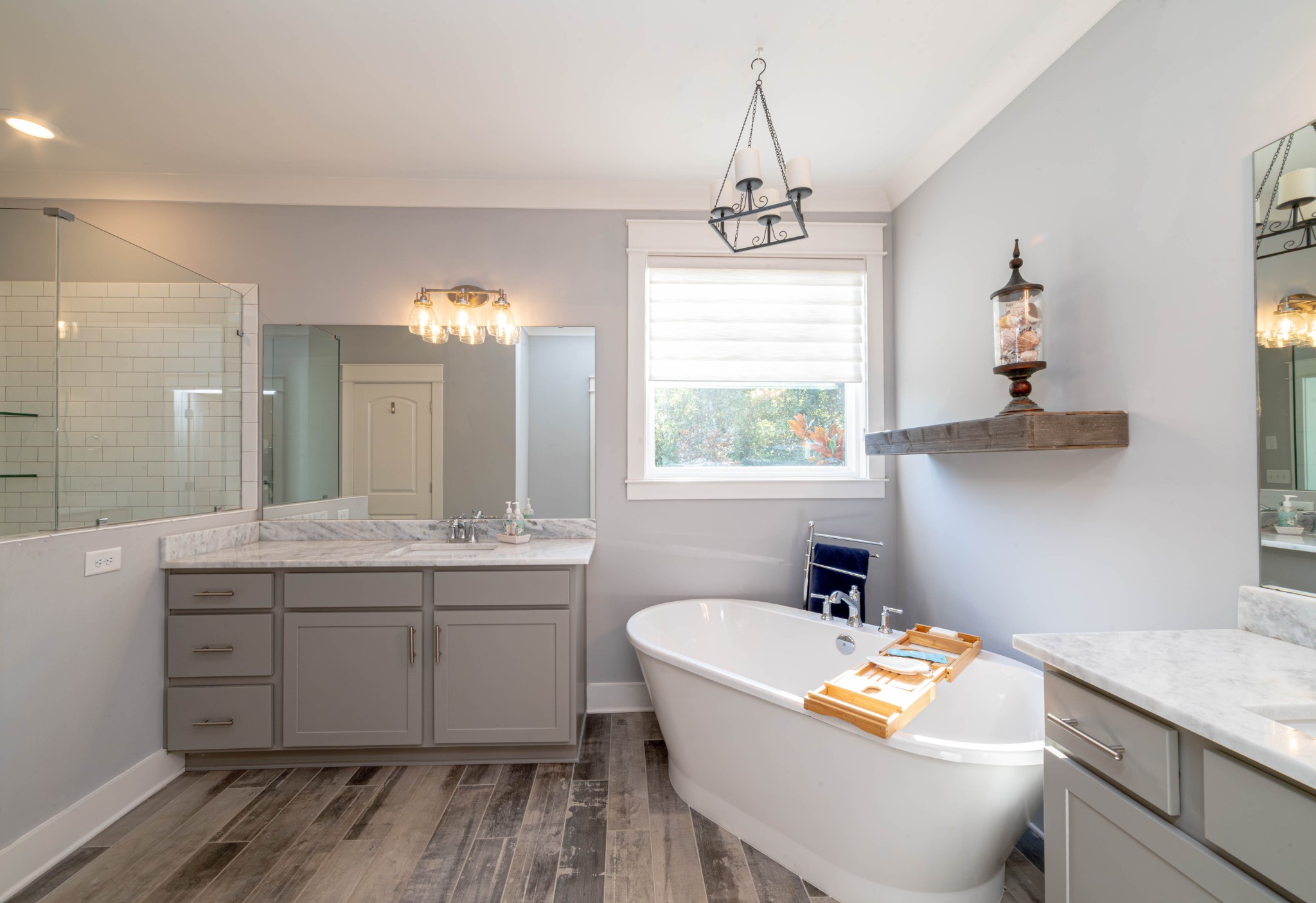 600 Beamon Drive Franklin, TN 37064 - Photo 17 of 24 a bathroom with a granite countertop sink a large mirror and a bathtub