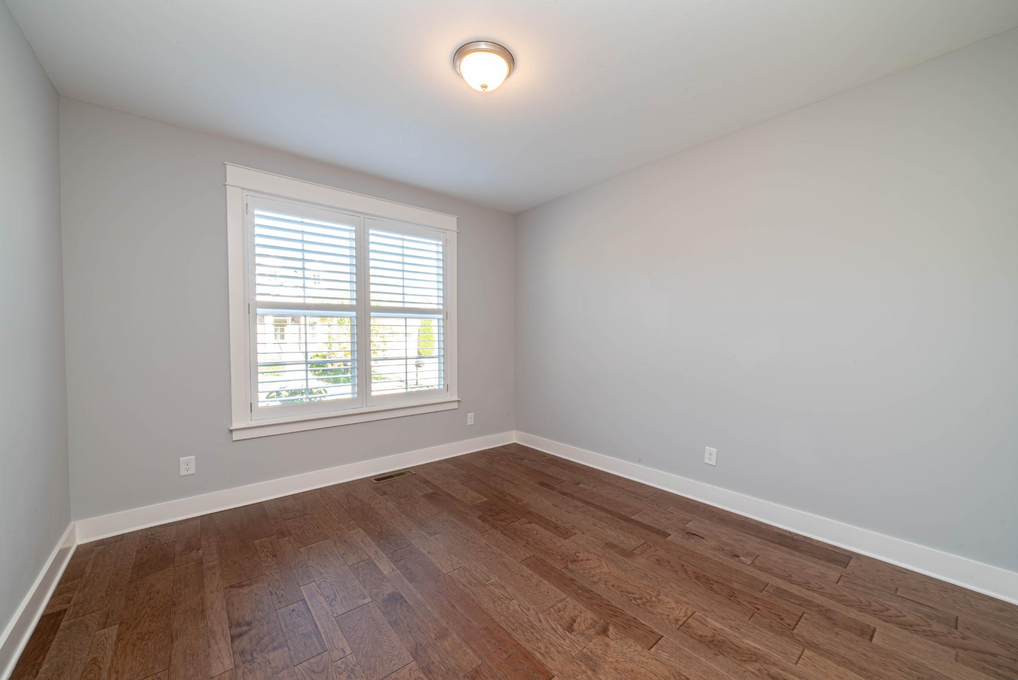 600 Beamon Drive Franklin, TN 37064 - Photo 18 of 24 an empty room with wooden floor and windows