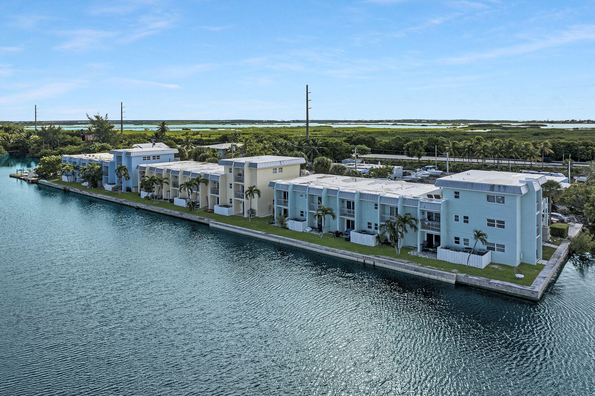 201 Coppitt Road, Unit 203B Key West, FL 33040 - Photo 11 of 44 a view of a city with lawn chairs