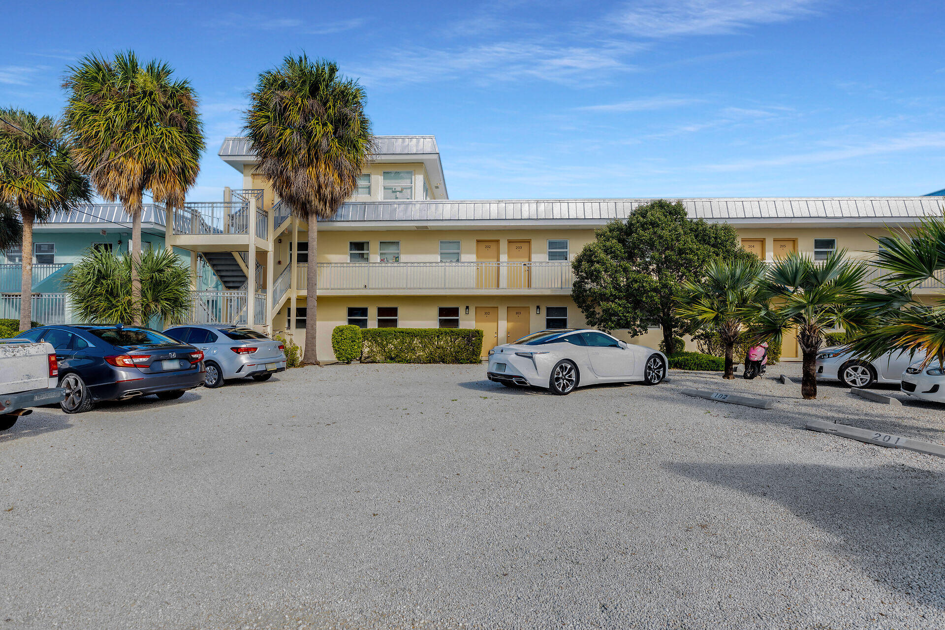 201 Coppitt Road, Unit 203B Key West, FL 33040 - Photo 13 of 44 a view of a cars parked in front of a building