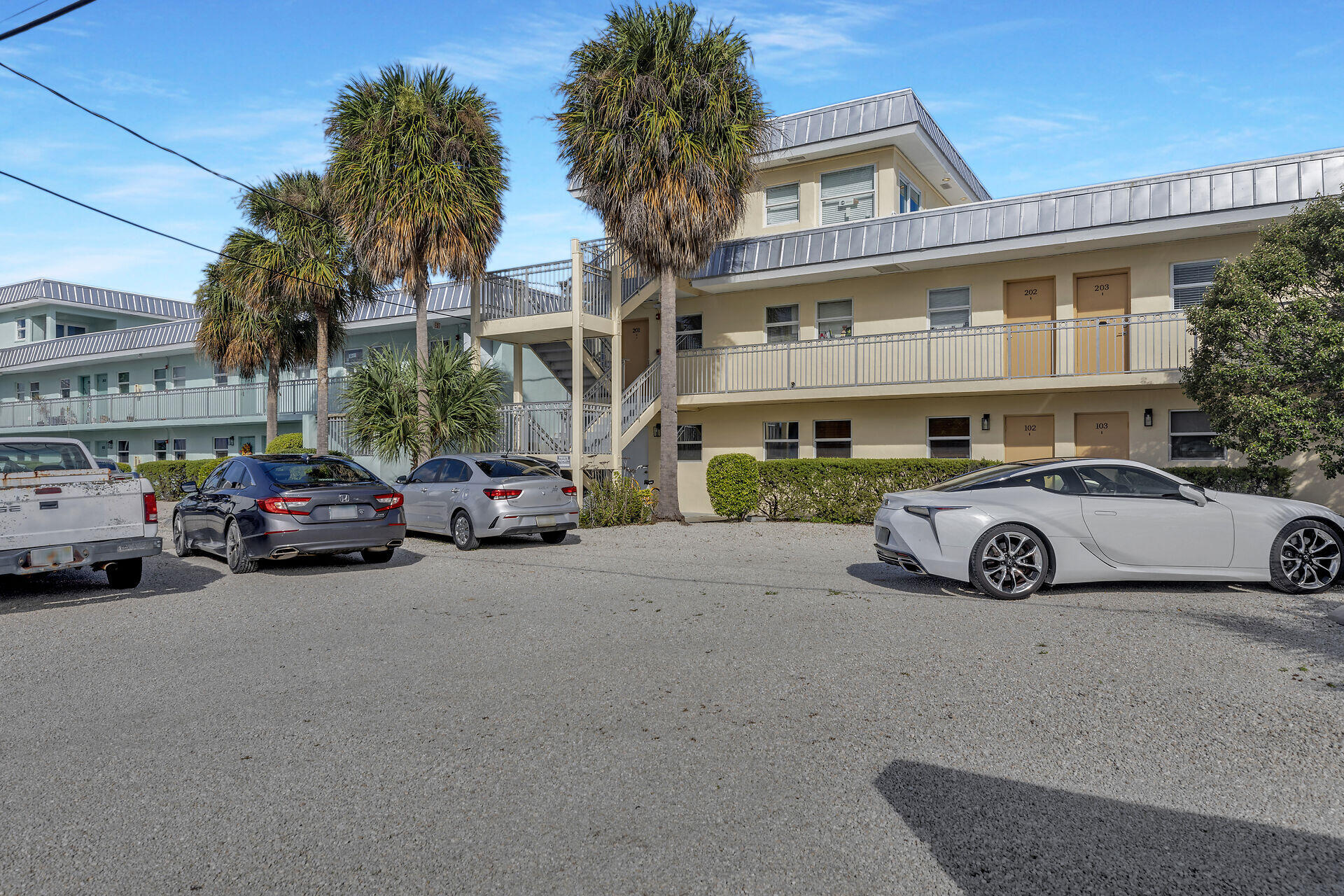 201 Coppitt Road, Unit 203B Key West, FL 33040 - Photo 14 of 44 a view of a cars parked in front of a building
