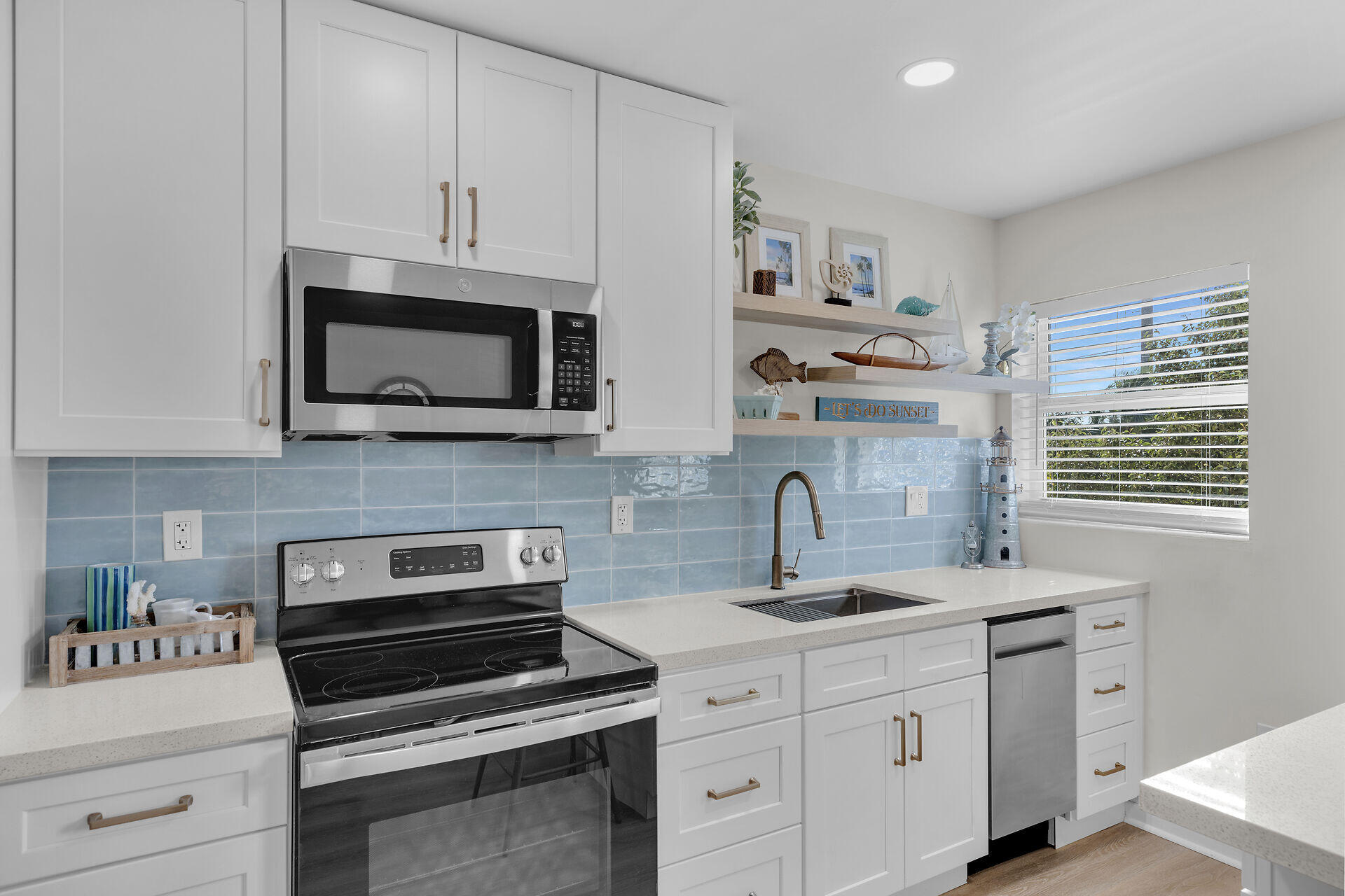201 Coppitt Road, Unit 203B Key West, FL 33040 - Photo 19 of 44 a kitchen with appliances a sink and cabinets