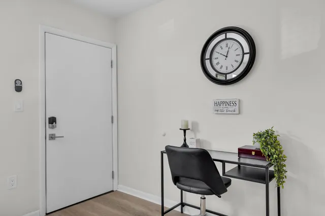 a view of a hallway with paintings on the wall
