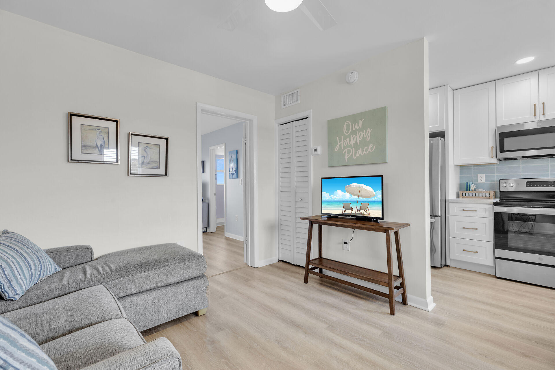 201 Coppitt Road, Unit 203B Key West, FL 33040 - Photo 24 of 44 a living room with furniture and a flat screen tv