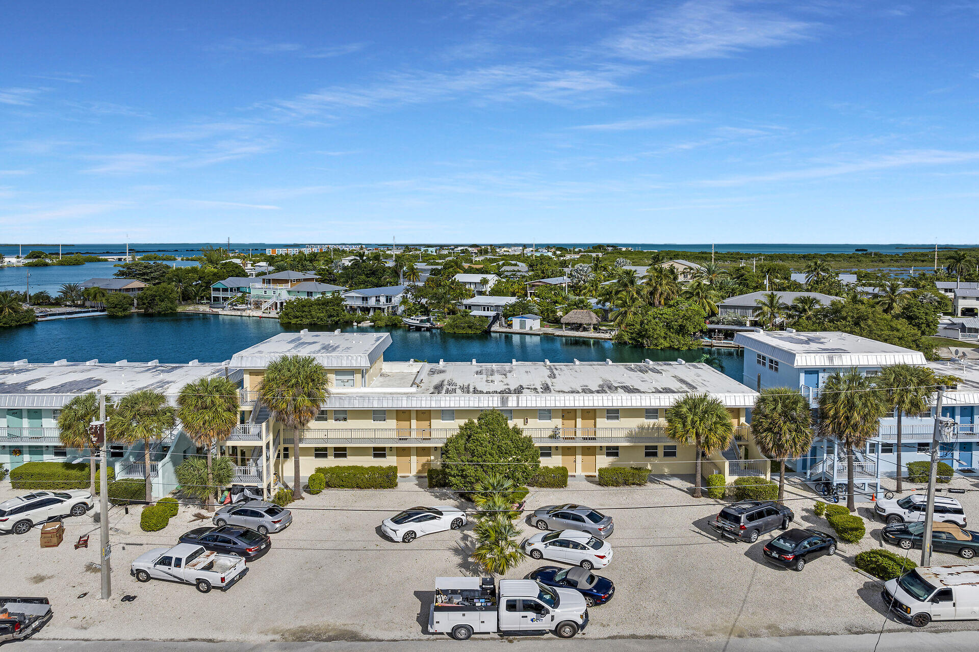 201 Coppitt Road, Unit 203B Key West, FL 33040 - Photo 3 of 44 an aerial view of a building with garden space and ocean view