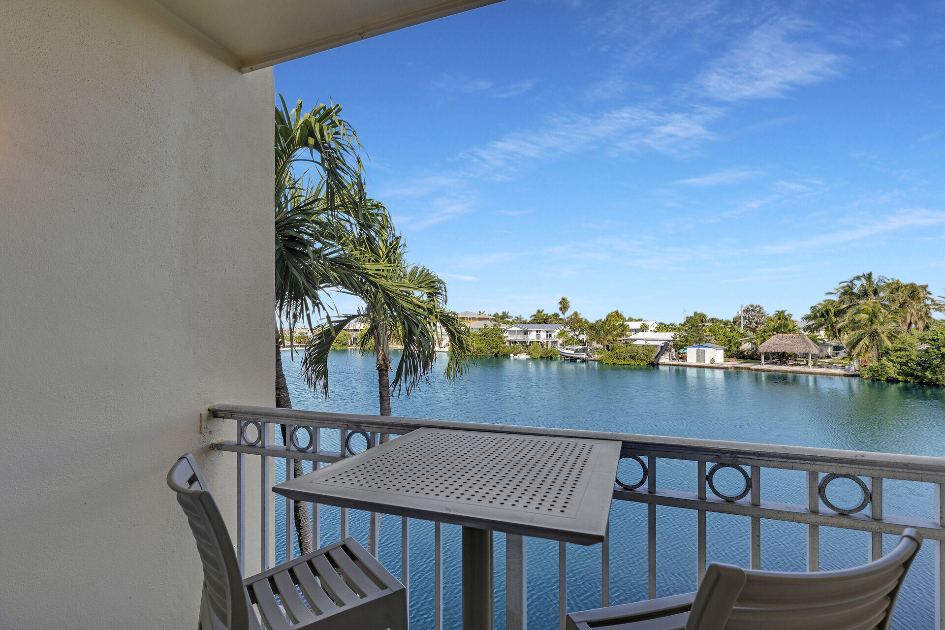 201 Coppitt Road, Unit 203B Key West, FL 33040 - Photo 31 of 44 a view of a chairs and table on the deck