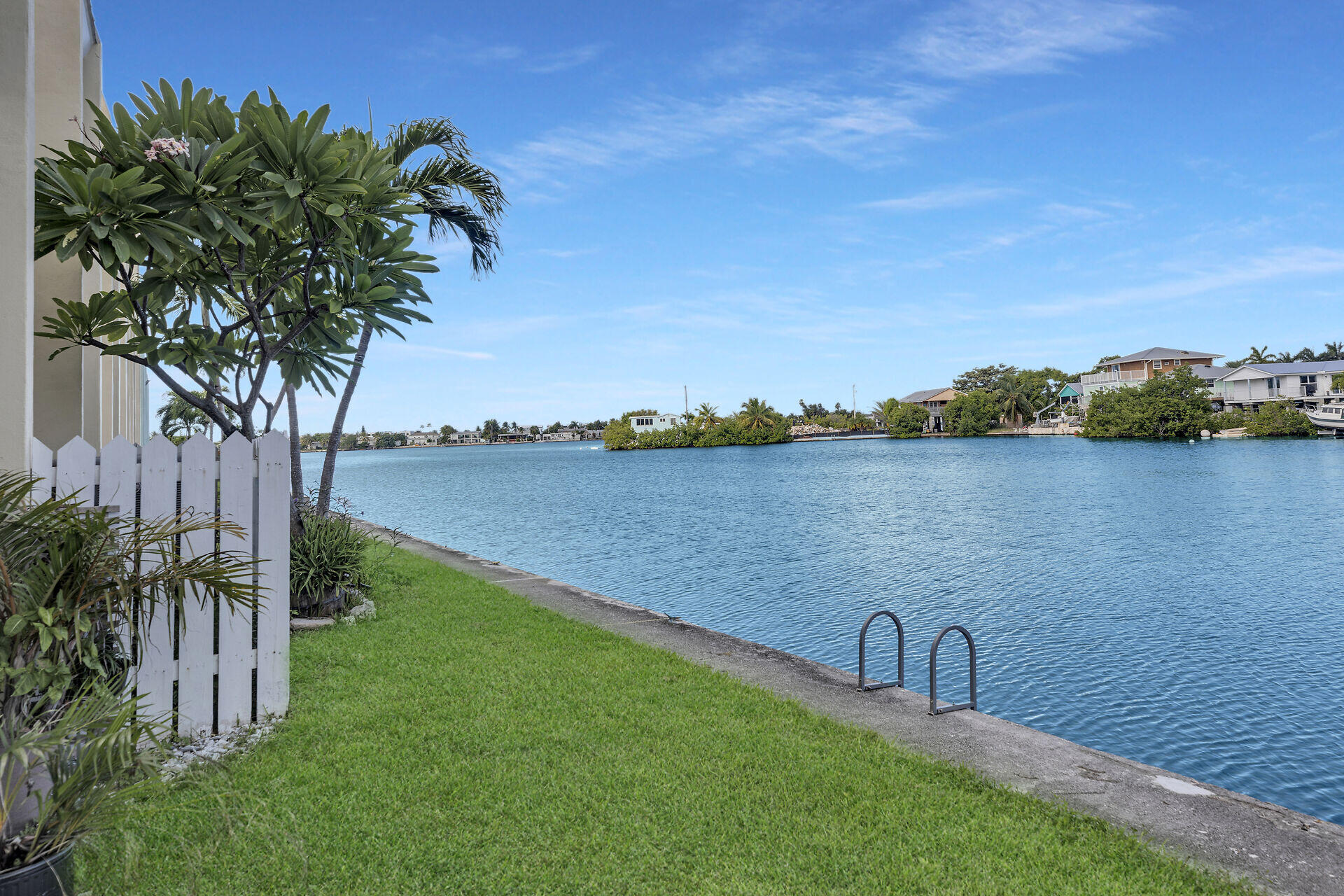 201 Coppitt Road, Unit 203B Key West, FL 33040 - Photo 37 of 44 a view of a lake with a garden and trees