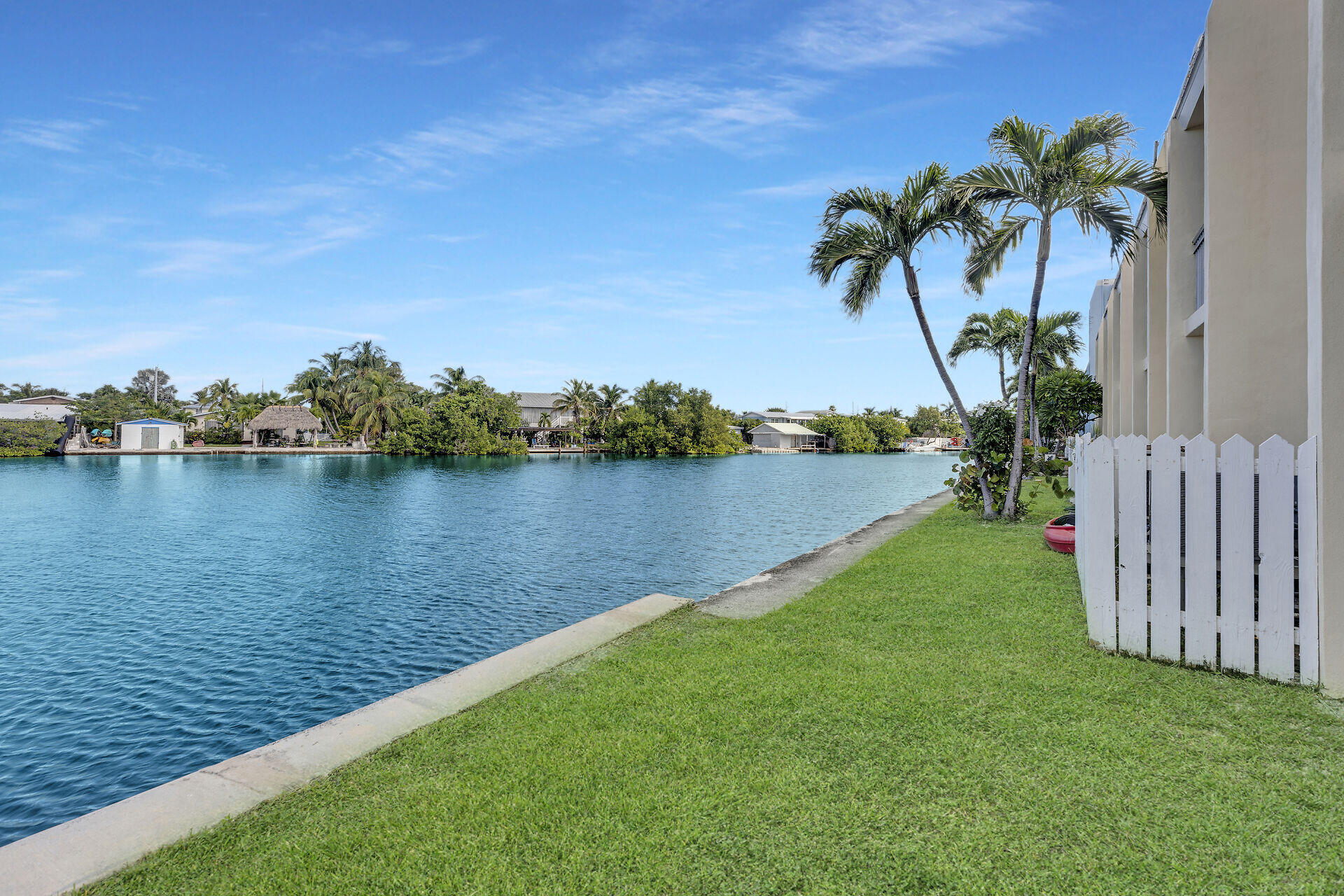 201 Coppitt Road, Unit 203B Key West, FL 33040 - Photo 39 of 44 a view of a lake with houses in the back