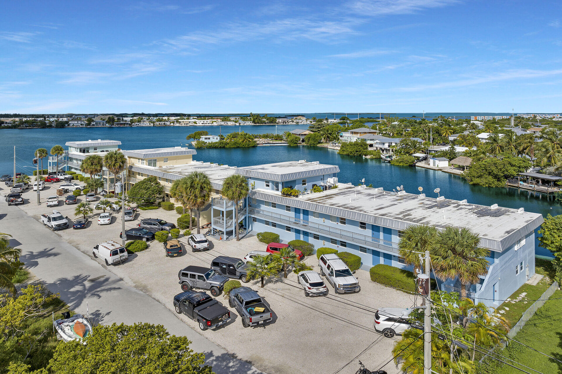 201 Coppitt Road, Unit 203B Key West, FL 33040 - Photo 5 of 44 an aerial view of a city with lawn chairs