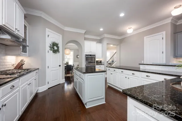 a kitchen with a sink stove and refrigerator