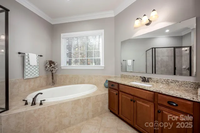 a bath tub sitting next to a bathroom sink