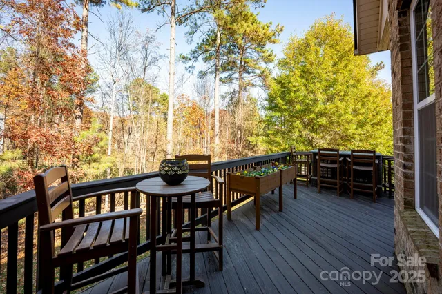 a view of a chairs and table on the deck