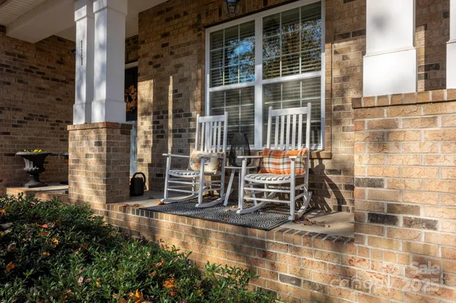 a view of a balcony with dining area