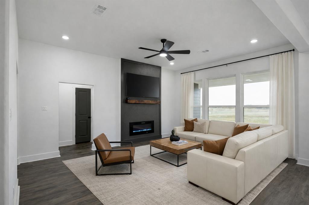 71 Arkansas Road Sadler, TX 76264 - Photo 16 of 35 a living room with furniture and a fireplace