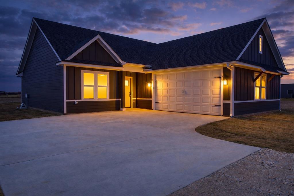 71 Arkansas Road Sadler, TX 76264 - Photo 32 of 35 a front view of a house with a yard