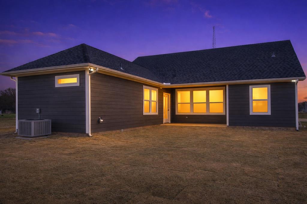 71 Arkansas Road Sadler, TX 76264 - Photo 34 of 35 a front view of a house with large windows