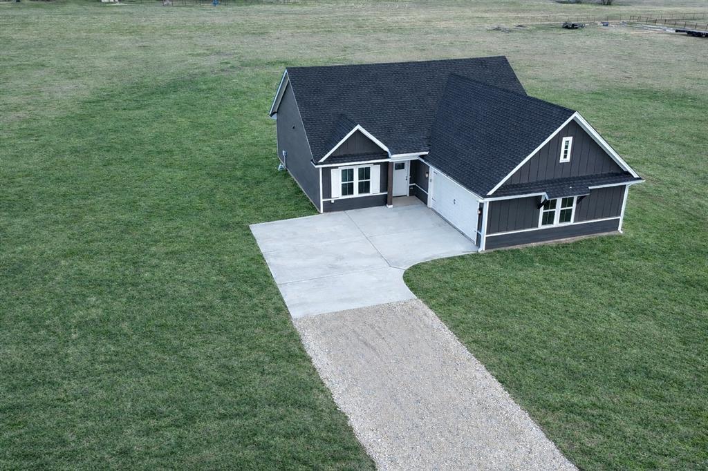 71 Arkansas Road Sadler, TX 76264 - Photo 5 of 35 a view of house with a yard