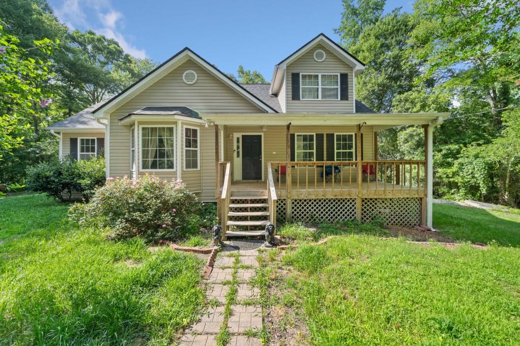 a front view of a house with garden