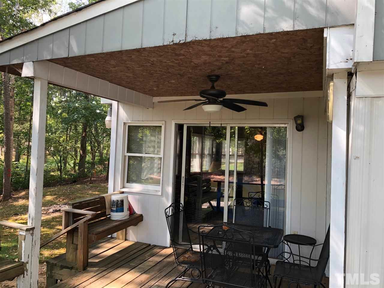 9546-9548 George Ruff Road Bullock, NC 27507 - Photo 17 of 25 a backyard of a house with seating space