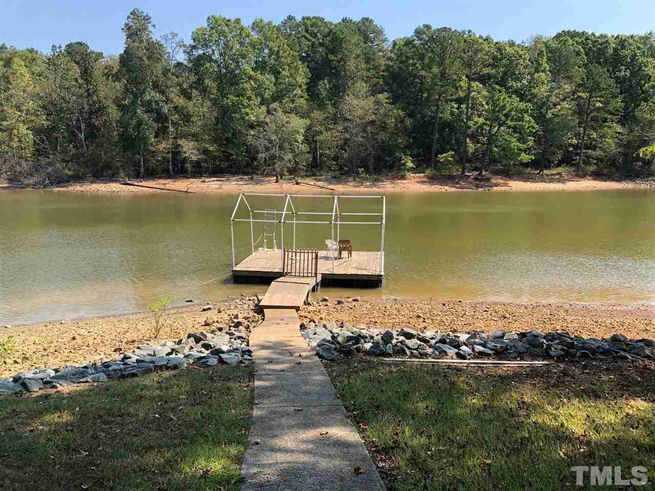 9546-9548 George Ruff Road Bullock, NC 27507 - Photo 20 of 25 a view of a lake with a big yard
