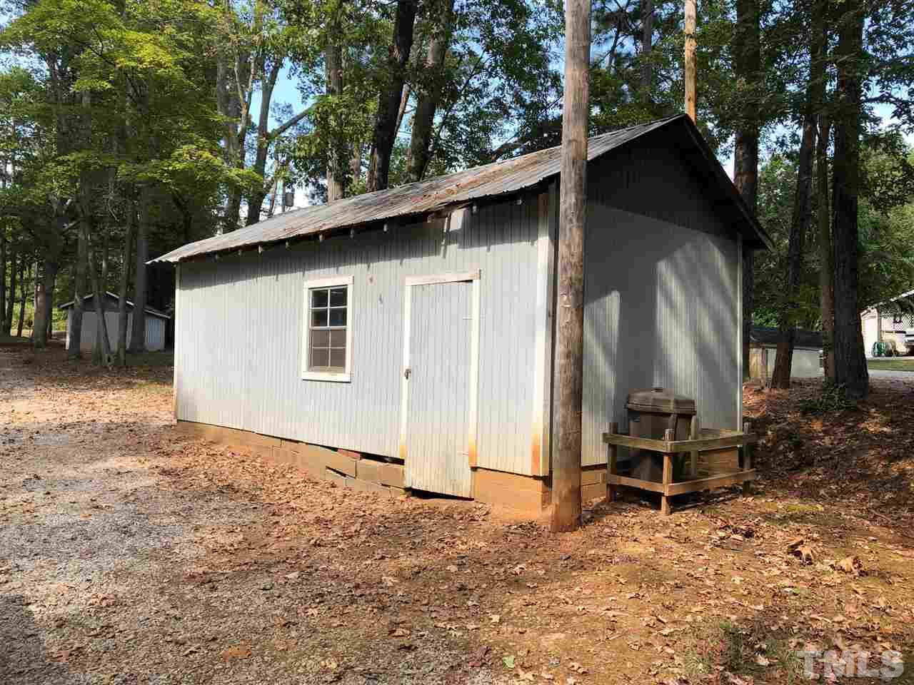 9546-9548 George Ruff Road Bullock, NC 27507 - Photo 22 of 25 a backyard of a house with table and chairs