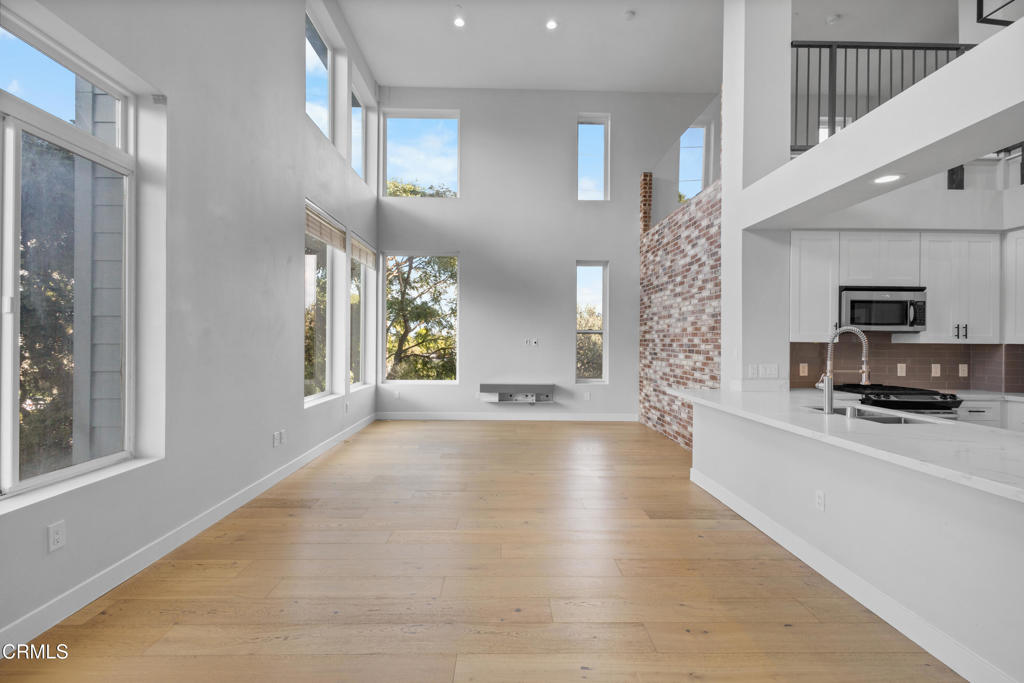 1901 South Victoria Avenue, Unit 204 Oxnard, CA 93035 - Photo 13 of 40 a view of a kitchen with furniture and windows