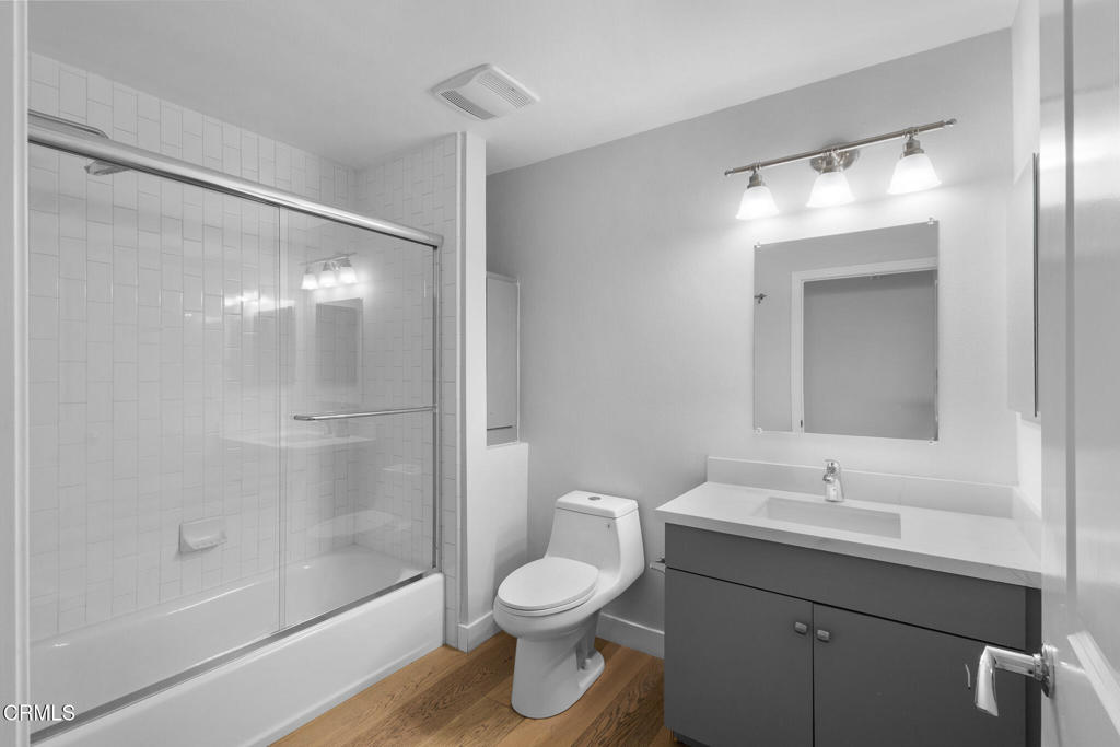 1901 South Victoria Avenue, Unit 204 Oxnard, CA 93035 - Photo 27 of 40 a bathroom with a toilet sink and shower