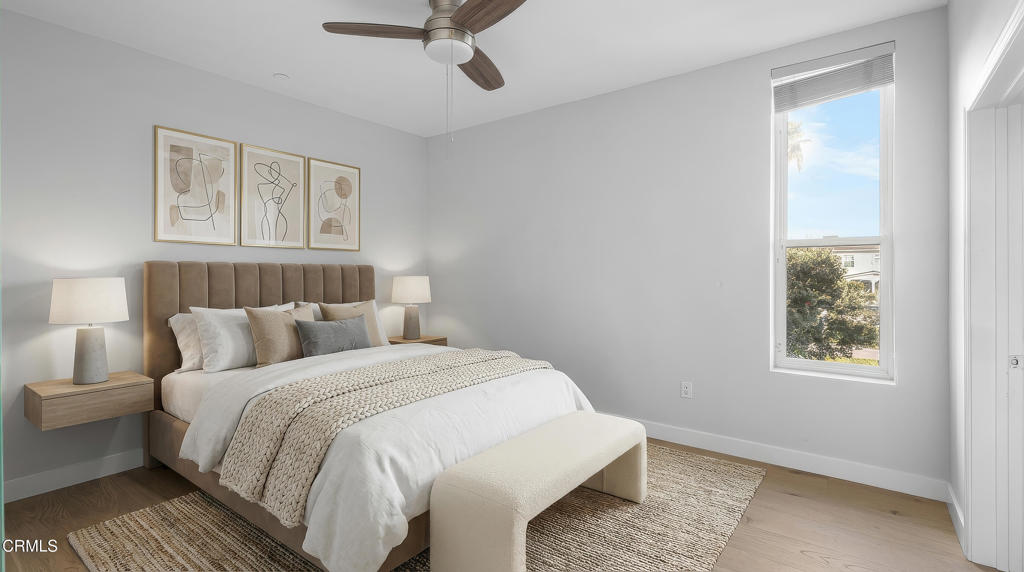 1901 South Victoria Avenue, Unit 204 Oxnard, CA 93035 - Photo 29 of 40 a bedroom with a bed and a painting on the wall