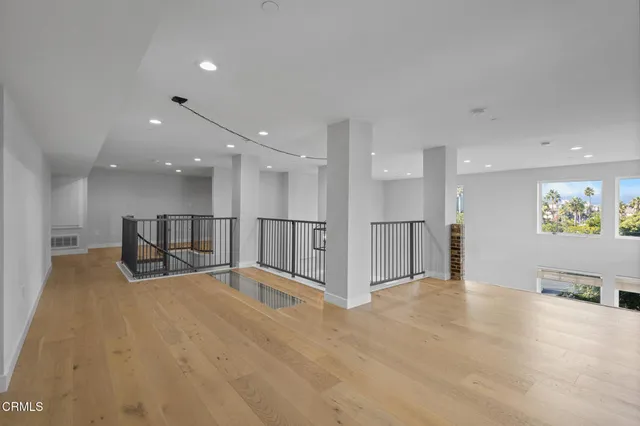 a view of kitchen with refrigerator and a sink