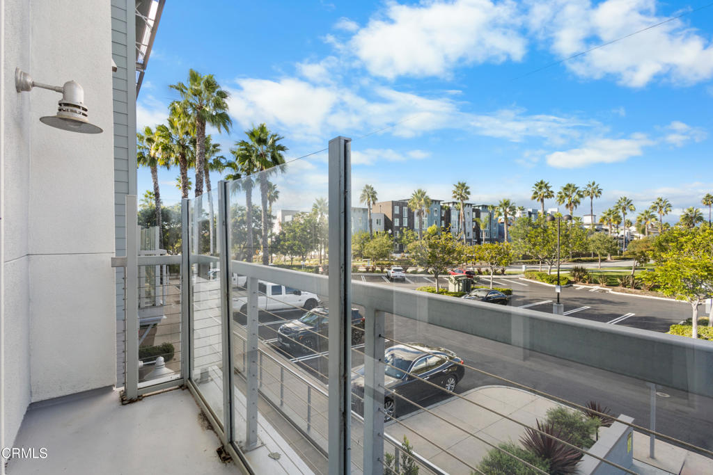 1901 South Victoria Avenue, Unit 204 Oxnard, CA 93035 - Photo 5 of 40 a view of a living room and a balcony