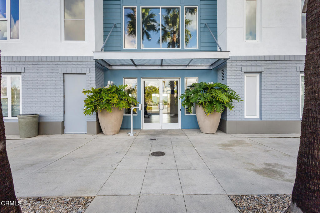 1901 South Victoria Avenue, Unit 204 Oxnard, CA 93035 - Photo 6 of 40 a view of a house with potted plants