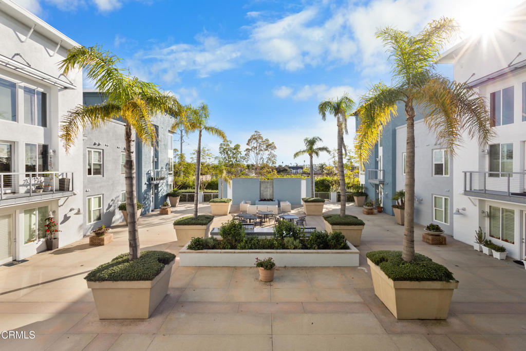 1901 South Victoria Avenue, Unit 204 Oxnard, CA 93035 - Photo 8 of 40 a swimming pool with outdoor seating and a potted plants